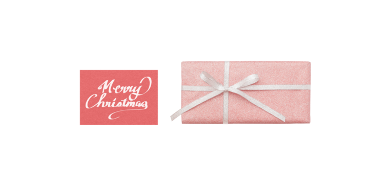A pale pink gift box and a red Christmas card with white handwritten text, seen from above - Powered by Adobe