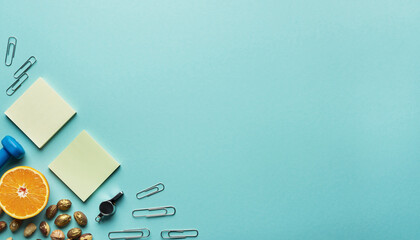 Healthy lifestyle planning with vibrant fruits, dumbbells and stationery items