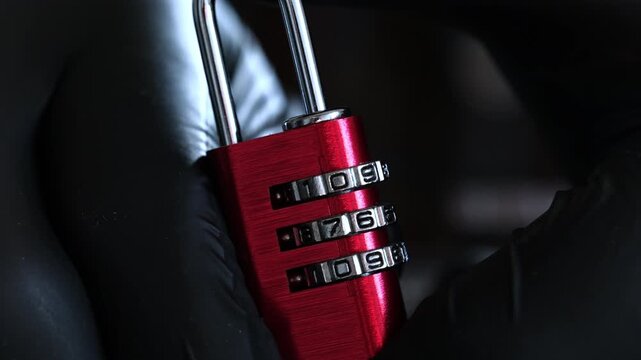 Person In Black Gloves Setting The Open Code On A Coding Lock For Luggage And Lockers