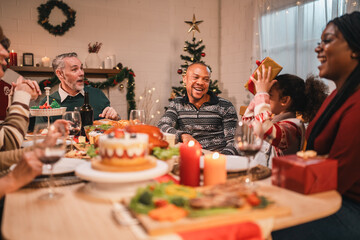 joyful family sharing a warm festive Christmas dinner creating happy memories together with laughter delicious food, spirit of love celebration togetherness around the holiday table