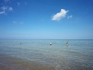 People swimming on a summer day in the Great Lakes