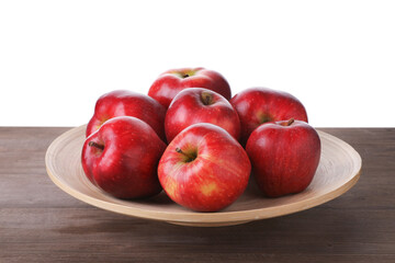 Ripe red apples on wooden table against white background, closeup