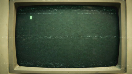 Abstract vintage computer monitor with green pixelated screen and blinking cursor. Retro technology display with static noise effect.
