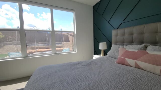 Stylish Bed With Colorful Decor, Charming Sleeping Area With Bright Teal Wall And Decorative Pillows 