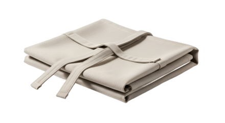 Neatly Folded Light Beige Textile Aprons with Ties on a Neutral Background