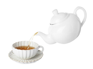 Pouring hot tea into cup from teapot on white background