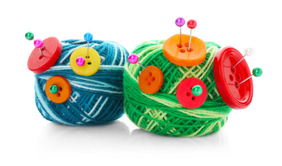 Balls of bright knitting yarn with buttons and pins isolated on white