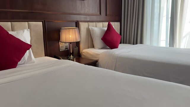 bright red pillows decoration in the hotel Comfortable double room in hotel with pillows, and folded bedding, passing video 4k resolution. 
