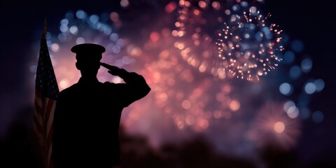 Silhouette of soldier saluting with fireworks and american flag in background