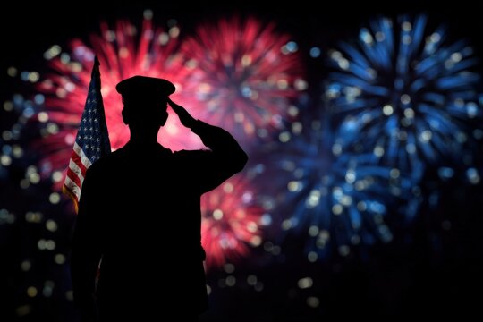 Silhouette of male soldier saluting american flag during vibrant fireworks display - Powered by Adobe