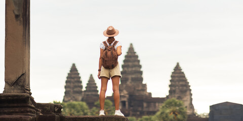 Backpacker Woman Looking At Angkor Wat, Iconic Cambodia Temple View