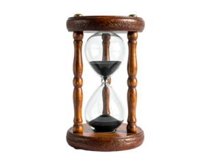 Ornate wooden hourglass with black sand flowing against dark