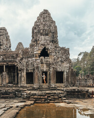 Female Traveler At Bayon Temple Doorway, Angkor Thom, Cambodia Tourism