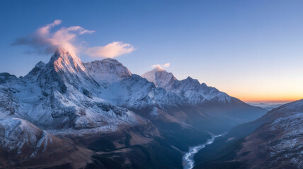 Majestic Snow-Capped Mountains at Sunrise with Winding River Valley and Pastel Sky Landscape