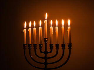 Fototapeta premium Illuminating Hanukkah with glowing candles, embrace traditions and celebrate the festival of lights with this warm holiday scene, evoking hope and joy