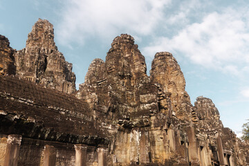 Bayon Temple Face Towers And Khmer Facade Under Blue Sky, Angkor Thom