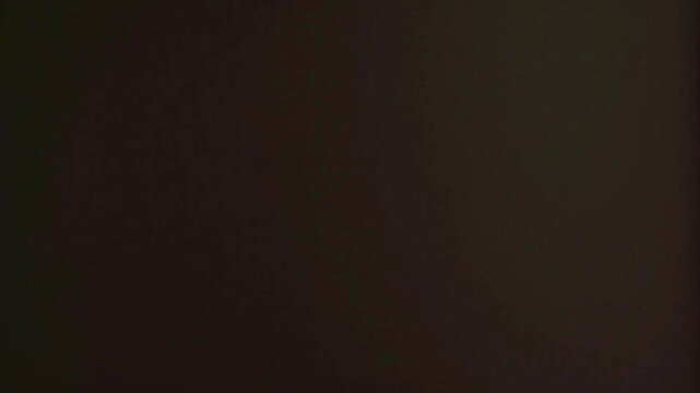Dark purple and dark blue abstract texture background with light rays and a hint of red flash film sign