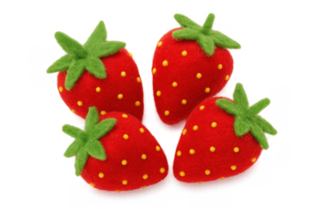 Four felt strawberries showing handmade craft toys with green leaves and yellow seeds on a transparent background