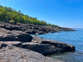 Black rocks on the scenic shore of Lake Superior in Michigan