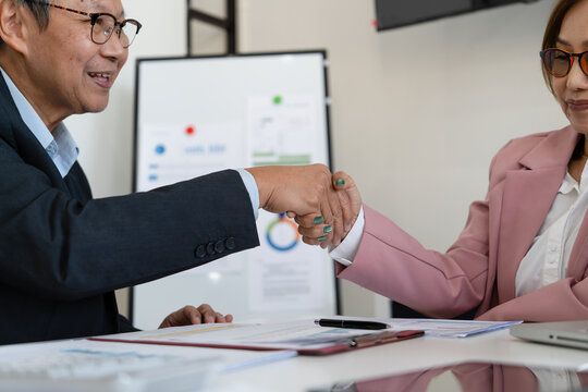 Senior businessmen calculating investment.