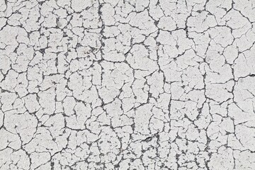 White cracked paint distressed background. Grunge peeling paint texture.