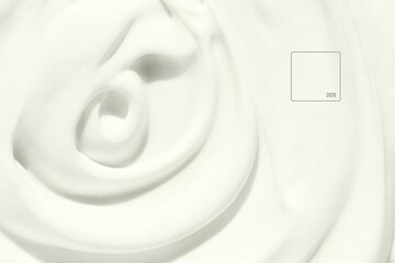Smooth swirling white cream texture in close up creating a soft minimal background with gentle...