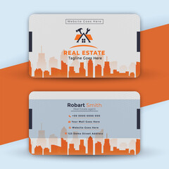 Real estate business card template design with city skyline