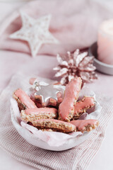 Christmas cookies with pink sugar frosting on pink background