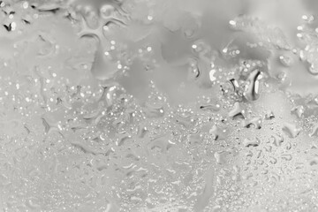 Abstract background with waterdrops on glass surface. Nature concept. Selective focus. Color of the year 2026 inspired