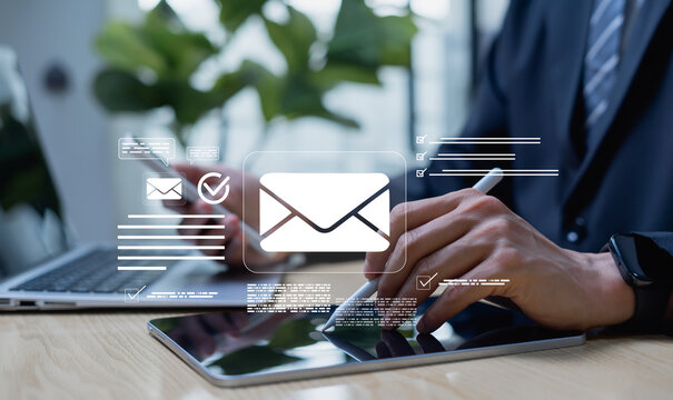 Digital email creation interface on a tablet with envelope icon, illustrating online communication, business messaging, and modern content writing in a digital workplace.