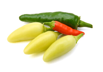 Stack colorful chili peppers isolated on the white