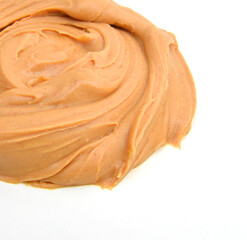 Creamy peanut butter on white