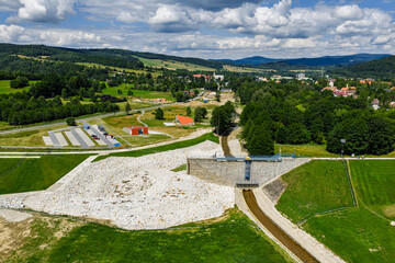 Fototapeta premium Aerial drone view of Stronie Slaskie town in Klodzko County Poland with scenic dam panorama. Stronie Slaskie city