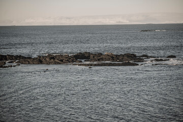 Rocky ocean coastline in soft light