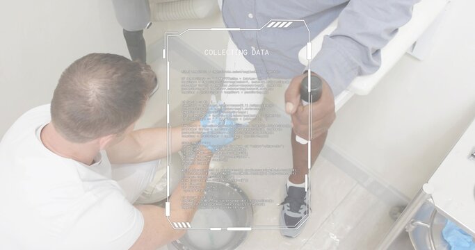 Kneeling clinician tending lower leg at clinic, with forearm crutch brace HUD COLLECTING DATA - Powered by Adobe