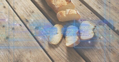 Displaying partially sliced crusty baguette with three slices on picnic table, blue HUD overlay © vectorfusionart