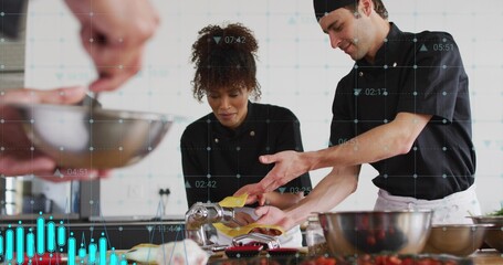 Feeding yellow pasta dough, two chefs in black jackets guiding pasta roller at counter, overlays
