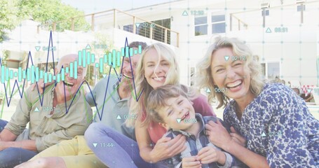 Sitting multi-generational family smiling on grassy lawn outside 2-story house with data overlay