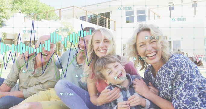 Sitting multi-generational family smiling on grassy lawn outside 2-story house with data overlay - Powered by Adobe