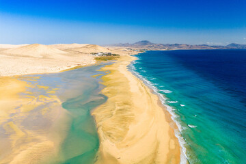 Playa de Sotavento is a famous beach on the southeastern coast of Fuerteventura, known for its long stretches of golden sand, turquoise water, and consistent winds © engel.ac