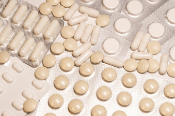 pills and blisters on white background