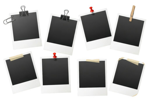 Collection of blank instant photo prints displayed on a black background