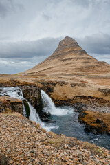 Kirkjufellsfoss waterfall and Kirkjufell mountain