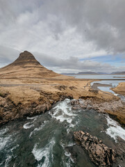 Kirkjufellsfoss waterfall and Kirkjufell mountain