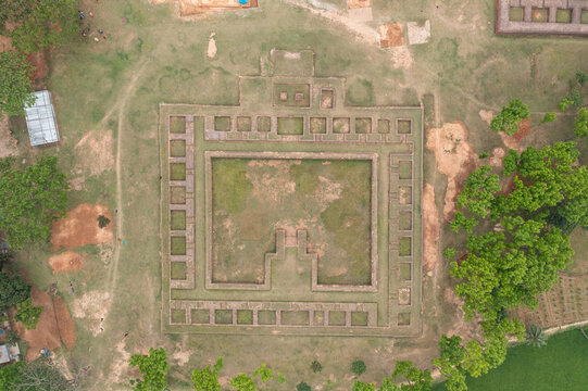 Aerial view of the ancient, symmetrical fortress standing with weathered stones and patches of green, surrounded by trees, Bogura, Rajshahi Division, Bangladesh.