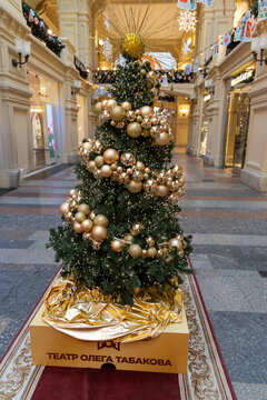 Russia. Moscow. GUM store. December 1, 2025. Golden Christmas tree with baubles, sponsored by Oleg Tabakov Theatre