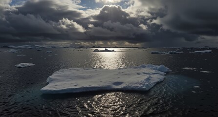 antarctic ice floe reflecting sunlight under dramatic cloudy sky in polar region