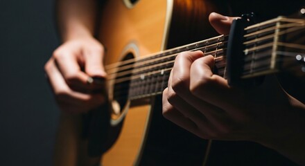 A close-up shot of a musician's hands playing chords on a wooden acoustic guitar with a capo.
