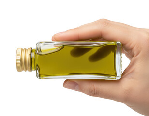 Hand holding a miniature glass bottle filled with golden olive oil