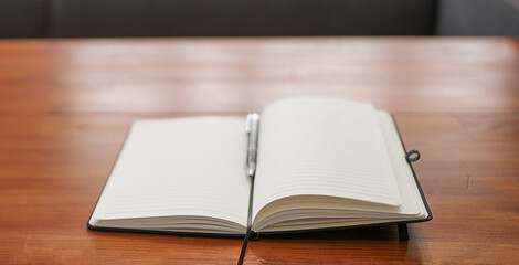 Open Notebook and Pen on a Warm Wooden Desk